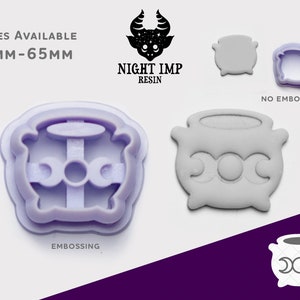 May include: A set of two purple plastic cookie cutters in the shape of a cauldron with a crescent moon design. The cutter on the left has an embossed design, while the cutter on the right is flat. The text "Sizes Available 7mm-65mm" and "Night Imp Resin" is visible in the image.