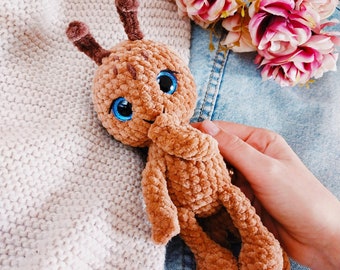 Brown crochet ant with blue eyes. Amigurumi insect. Soft plush toy for sleep. Gift for a child.