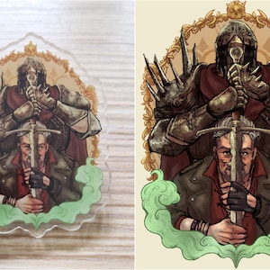 May include: A green and gold illustrated acrylic charm featuring a man holding a sword with a knight in armor behind him. The knight is holding the sword with both hands. The man is wearing a brown leather jacket and a red shirt. The background is a green and gold swirl.