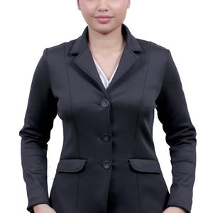 May include: A black blazer with a four-button fastening and two front pockets. The blazer has a tailored fit and a classic style.