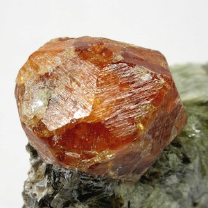 SPESSARTINE GARNET - Super Spessartine Garnet attached to Mica matrix from Tanzania.