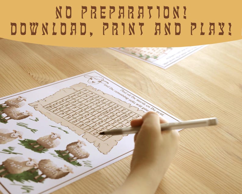 May include: A printed word search puzzle featuring sheep illustrations and the text "NO PREPARATION! DOWNLOAD, PRINT AND PLAY!". A hand holds a pen, completing the puzzle on a wooden surface. The puzzle is designed for children.