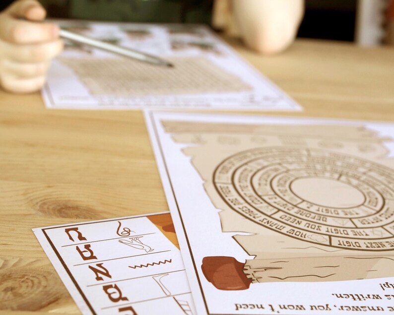 May include: A tabletop scene featuring printed puzzle sheets with circular and rectangular designs. One sheet has a compass-like graphic. A hand holds a pen, suggesting active engagement with the puzzles. The color palette is muted, with beige and brown tones.