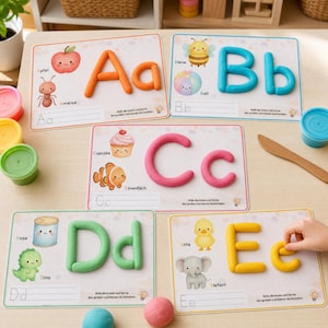 May include: Five educational activity mats featuring letters A through E formed with colorful modeling clay. Each mat displays illustrations of objects and animals corresponding to the letter, along with blank lines for writing practice.