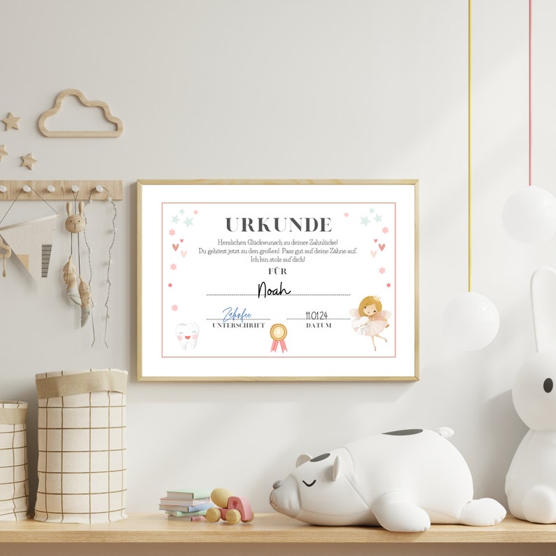 May include: A pink and white certificate with a pink border and stars. The text reads "URKUNDE" and "Herzlchen Gl&uuml;ckwunsch zu deiner Zahnl&uuml;cke! Du geh&ouml;rst jetzt zu den Gro&szlig;en. Pass gut auf deine Z&auml;hne auf! Ich bin stolz auf dich!"  The certificate is for "Noah".