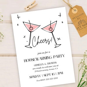 May include: A white invitation card with black text and a pink illustration of two martini glasses. The text reads "Cheers!" and "Join us for a Housewarming Party". The invitation is for Ophelia & Thomas on Sunday, September 16th at 7pm. The text RSVP is 555-555-5555.