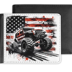 May include: A black leather wallet with a graphic of a red monster truck against a distressed American flag background. The wallet is open, revealing the interior, and has a bi-fold design.