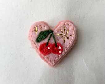 Cherry heart shaped mini pin/brooch/button with metallic gold star accents//hand embroidered whimsical/cottagecore pink felt fiber art pin