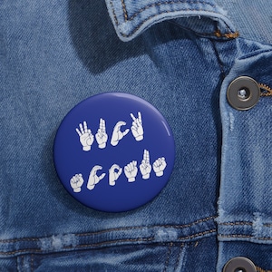 May include: A blue button with the word "WAC" spelled out in American Sign Language.