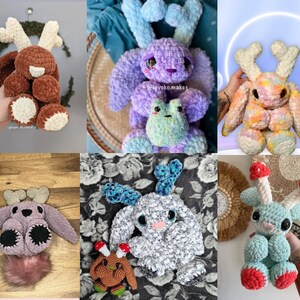 May include: A selection of handmade crochet plush toys. The collection includes a brown deer-like creature with cream antlers, a purple bunny with blue ears, and a blue creature with mushroom-shaped antlers. Each has large eyes.