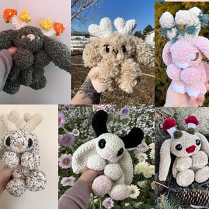 May include: A selection of handmade crochet plush toys in diverse colours and designs. The plushies have mushroom, antler, and bunny-like features. The colour scheme includes green, brown, pink, white, and black. These soft toys are suitable for children or as decorative items.