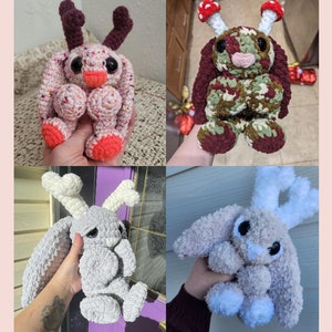 May include: Four handmade crochet bunny plushies. Each bunny has unique features: one with antlers and coral accents, another with mushroom-shaped ears, a grey bunny with bone-shaped ears, and a light brown bunny with white accents.