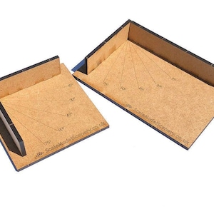 May include: Two wooden angle jigs with black edges and markings for different angles. The jigs are made by Scale Model Scenery Co. UK.