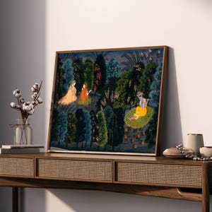 May include: A framed painting showing a detailed forest scene with figures in traditional dress. The artwork uses blues, greens, and oranges, with intricate details in the foliage and figures. The painting is displayed on a wooden console table.