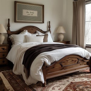 May include: A bedroom scene featuring a wooden bed with a dark brown blanket and white bedding. A framed artwork with the text "how lucky are we" hangs above the bed. Two bedside lamps and a patterned rug complete the cozy, inviting space.
