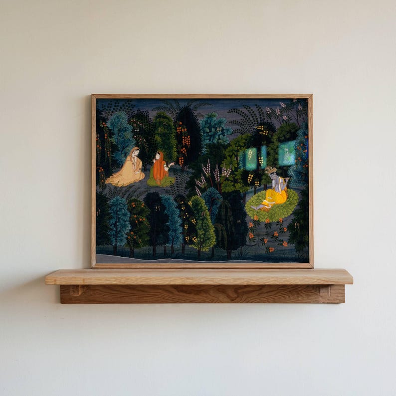 May include: A framed artwork showing a forest scene with figures in colourful clothing. The painting, in a wooden frame, is displayed on a wooden shelf against a white wall. The artwork features a rich colour palette with detailed foliage and figures.