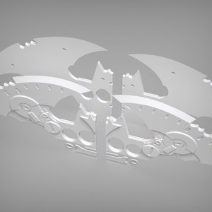 May include: A white metal model of a bat wing with intricate details and gears. The model is made up of multiple pieces that fit together.