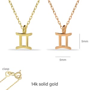May include: Two gold necklaces with a Gemini zodiac symbol pendant. The pendant is 5mm wide and 5mm tall. The necklaces are 14k solid gold.