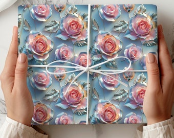 May include: A gift box wrapped in blue and silver wrapping paper with a pink and white floral pattern. The paper features a 3D embossed design of roses.