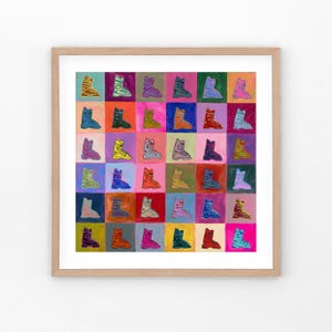 May include: A framed print of a colorful pattern of ski boots. The boots are painted in various shades of blue, green, yellow, orange, red, and purple. The background is a grid of squares in different colors.