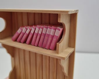 Pink books in miniature