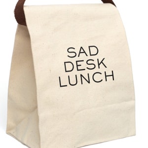 Sad Desk Lunch Bag With Strap, This ludicrously capacious canvas lunch bag makes a great coworker gift