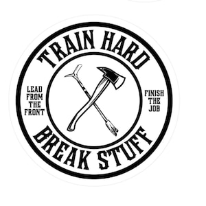 May include: Black and white circular sticker with the text "Train Hard Break Stuff" in a bold font. The text is surrounded by a thick black circle. Inside the circle is a crossed axe and pickaxe. The text "Lead from the front" is on the left side of the axe and pickaxe and the text "Finish the job" is on the right side.