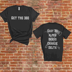 May include: Two black t-shirts with white text. The front shirt says "GET THE 360". The back shirt says "EASY AS ALPHA BRAVO CHARLIE DELTA" with a graphic of two crossed axes.