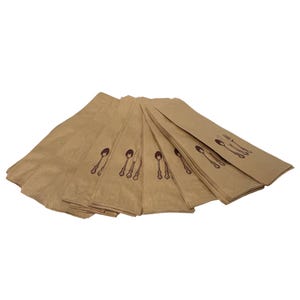 May include: A stack of light brown paper cutlery sleeves featuring a dark brown printed graphic of a spoon, fork, and knife on the front. Each sleeve is rectangular and designed to hold utensils, arranged in a fan-like overlapping formation.