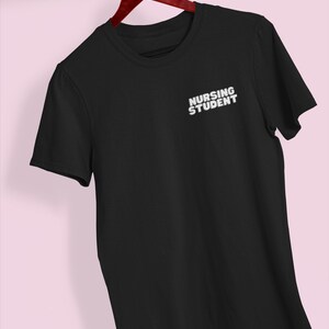 May include: Black t-shirt with the text "Nursing Student" in white lettering.