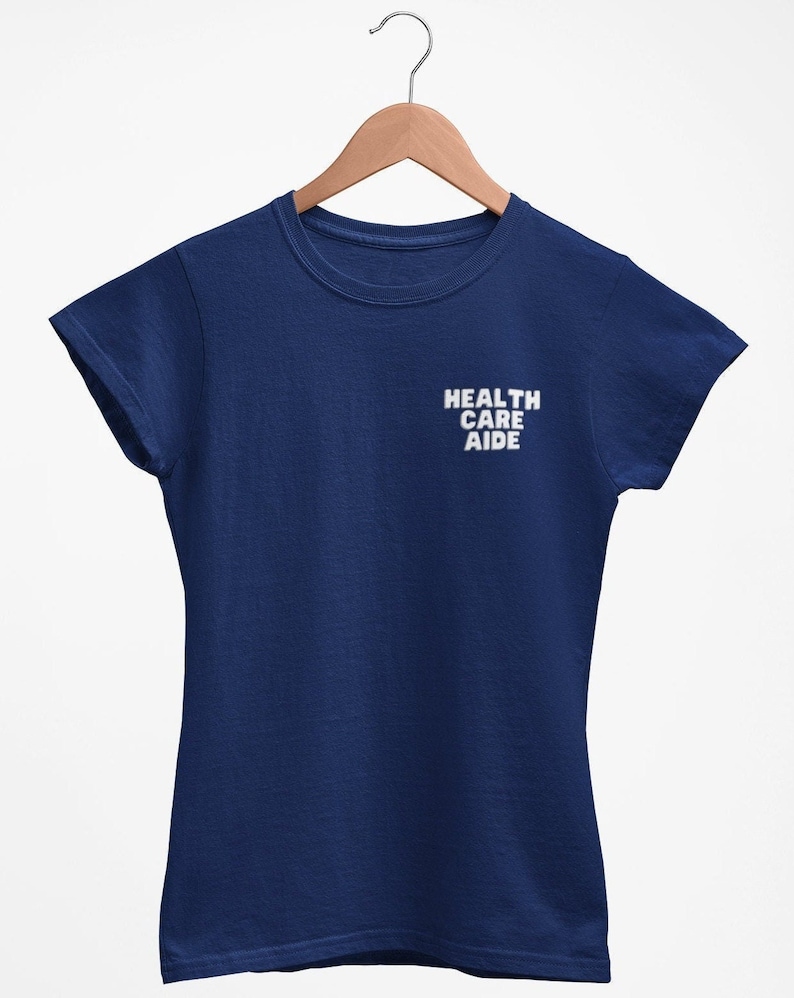May include: A navy blue t-shirt with the text "HEALTH CARE AIDE" printed in white on the front.