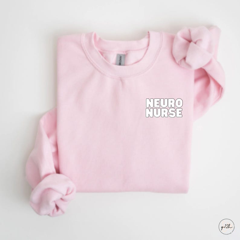 May include: Pink crewneck sweatshirt with the text "NEURO NURSE" in white on the front.