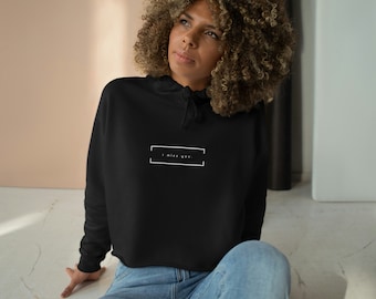 May include: A black cropped hoodie with a white box and the text "I miss you." printed on the front.