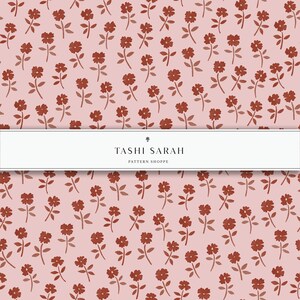 May include: A seamless pattern featuring a repeating design of small, red flowers with green stems on a light pink background. The pattern is labeled "TASHI SARAH PATTERN SHOPPE".