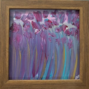 May include: Abstract floral painting in a wooden frame. The artwork features purple and pink brushstrokes depicting flowers and stems against a light blue and gray background. The painting is signed in the bottom right corner.