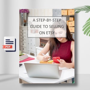 May include: A PDF guide with the text "A Step-by-Step Guide to Selling on Etsy" on a white background. A woman is sitting at a desk with a laptop, a phone, and a pen. She is looking at the phone and writing on a piece of paper.