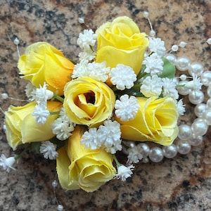 Yellow rose bud wrist corsage. Wedding or prom corsage