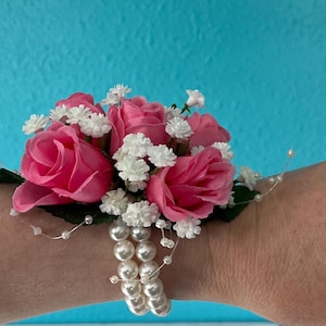 Pink rose wrist corsage.