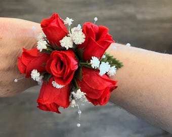 Red rose wrist corsage.