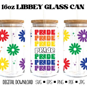 May include: Three 16oz glass jars with wooden lids and rainbow pride text and flower designs. The jars are clear glass and have a textured surface. The text on the jars reads "PRIDE" in rainbow colors.