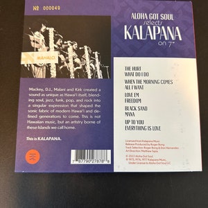 May include: A purple and white vinyl record cover with the title "Aloha Got Soul selects Kalapana on 7" ". The cover features a photo of the band Kalapana performing on stage. The back of the cover lists the songs on the record, "The Hurt", "What Do I Do", "When The Morning Comes", "All I Want", "Love Em", "Freedom", "Black Sand", "Mana", "Up To You", and "Everything Is Love".