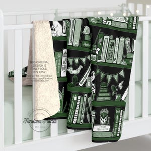 May include: A black and green blanket with a bookshelf design, featuring book titles and decorative elements. The blanket has a soft, cream-colored sherpa lining. The text "Fandom Planet" and "EST 2023" are visible.