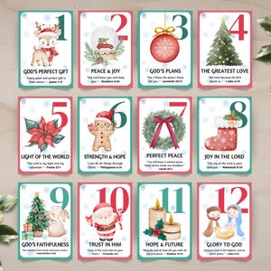 May include: Set of 12 Christmas-themed cards with watercolor illustrations and text. Each card features a number, a festive image like a reindeer or Santa, and a related inspirational quote. The cards have a teal border and red accents.