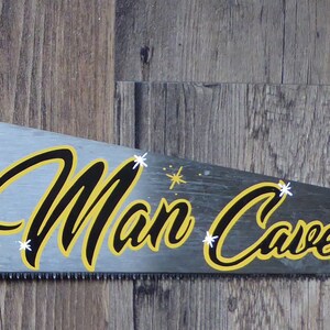 The Man Cave - hand painted saw sign (black & yellow star detail)