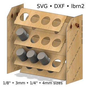 May include: A wooden storage rack with three angled shelves, each with five circular openings. Gray cylindrical objects are partially inserted into the openings. The text "SVG • DXF • lbrn2" and "1/8" • 3mm • 1/4" • 4mm sizes" are visible.