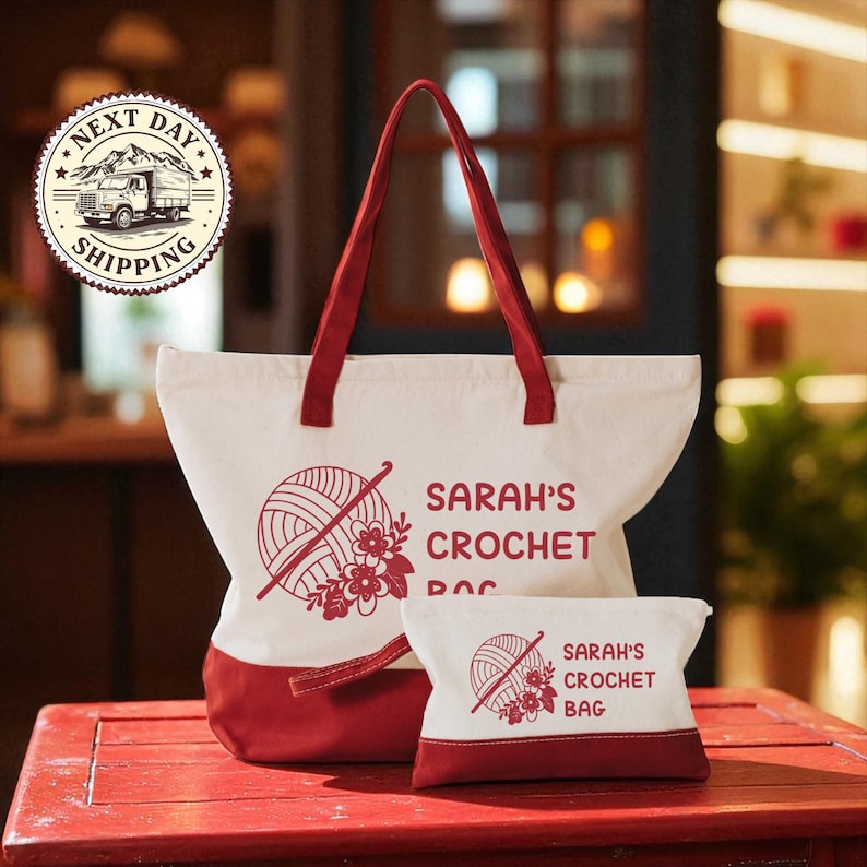 A red and white tote bag with the text "SARAH'S CROCHET BAG" printed on it, along with a smaller bag that says "SARAH'S CROCHET BAG" on it. The bag is placed on a red surface, and there is a logo in the background that says "NEXT DAY SHIPPING".