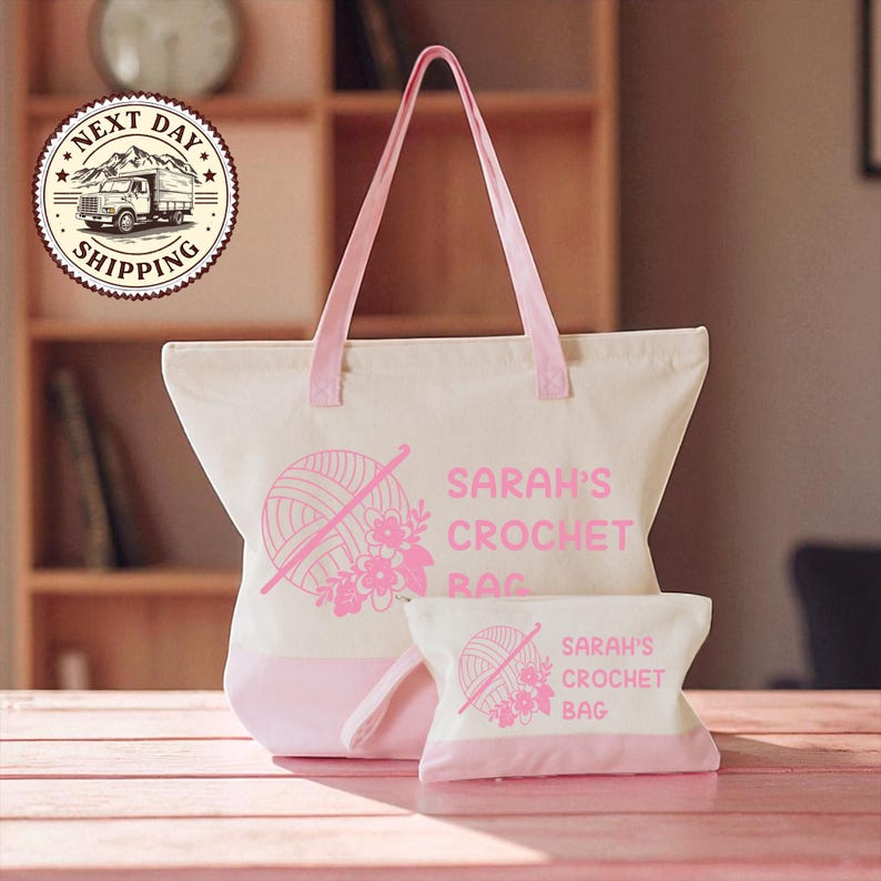 A large white tote bag with pink accents and a smaller white bag with pink accents, both featuring the text "SARAH'S CROCHET BAG" and a crochet ball graphic.