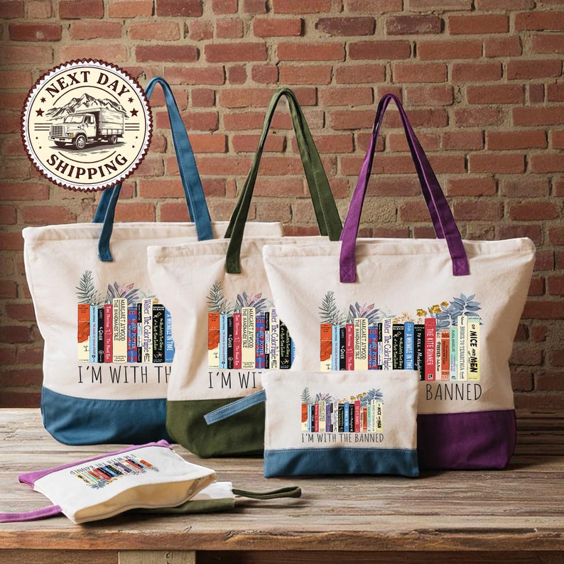 a collection of colorful tote bags and a small bag, all with the same design and text, placed on a wooden surface against a brick wall background.