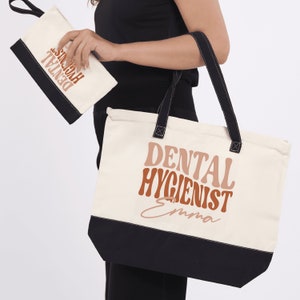 a woman holding a tote bag that says dental hygienist