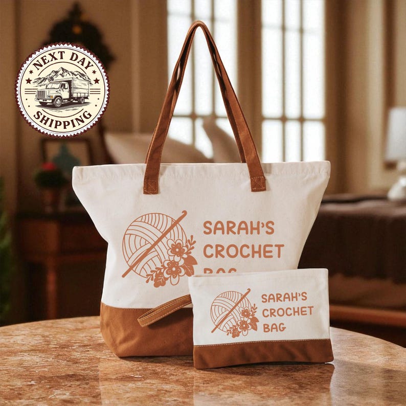 A white tote bag with brown handles and a smaller bag with a similar design, both featuring the text "SARAH'S CROCHET BAG" and a crochet ball graphic.